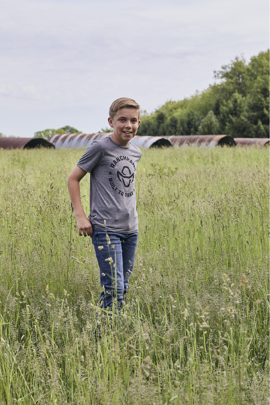 Boy Wearing Ranch Hand Built to Take a Hit Youth T-shirt