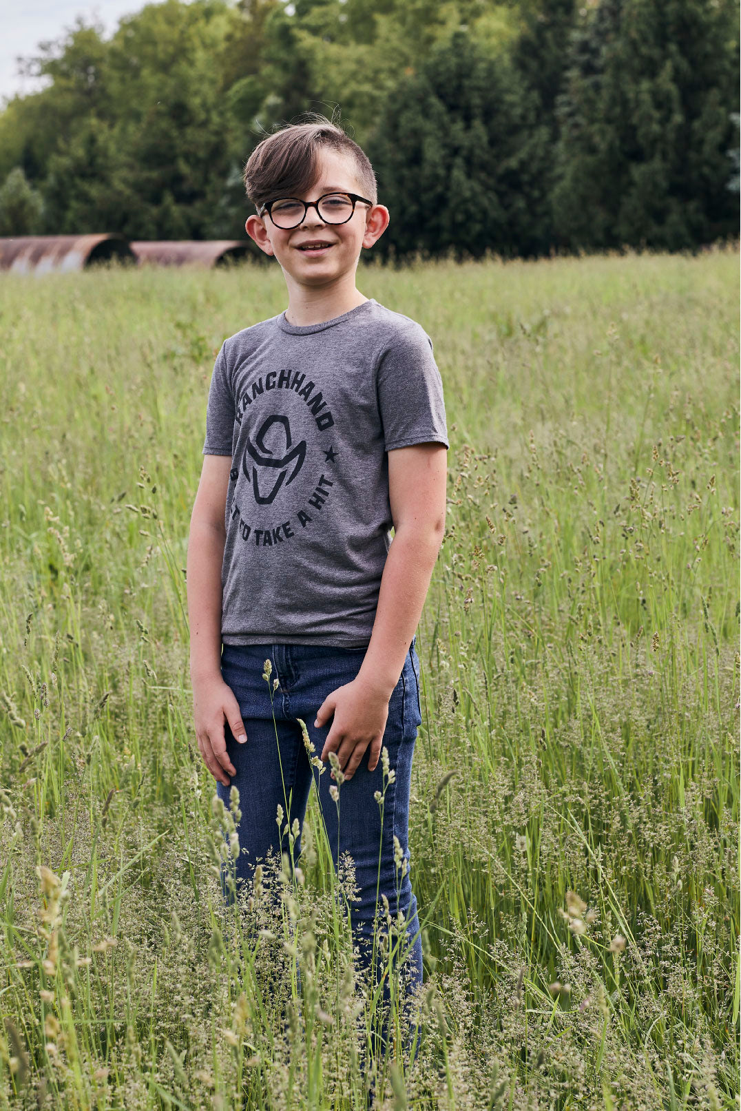 Boy Wearing Ranch Hand Built to Take a Hit Youth T-shirt